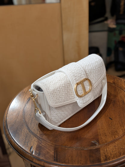 Borsa a tracolla in materiale intrecciato